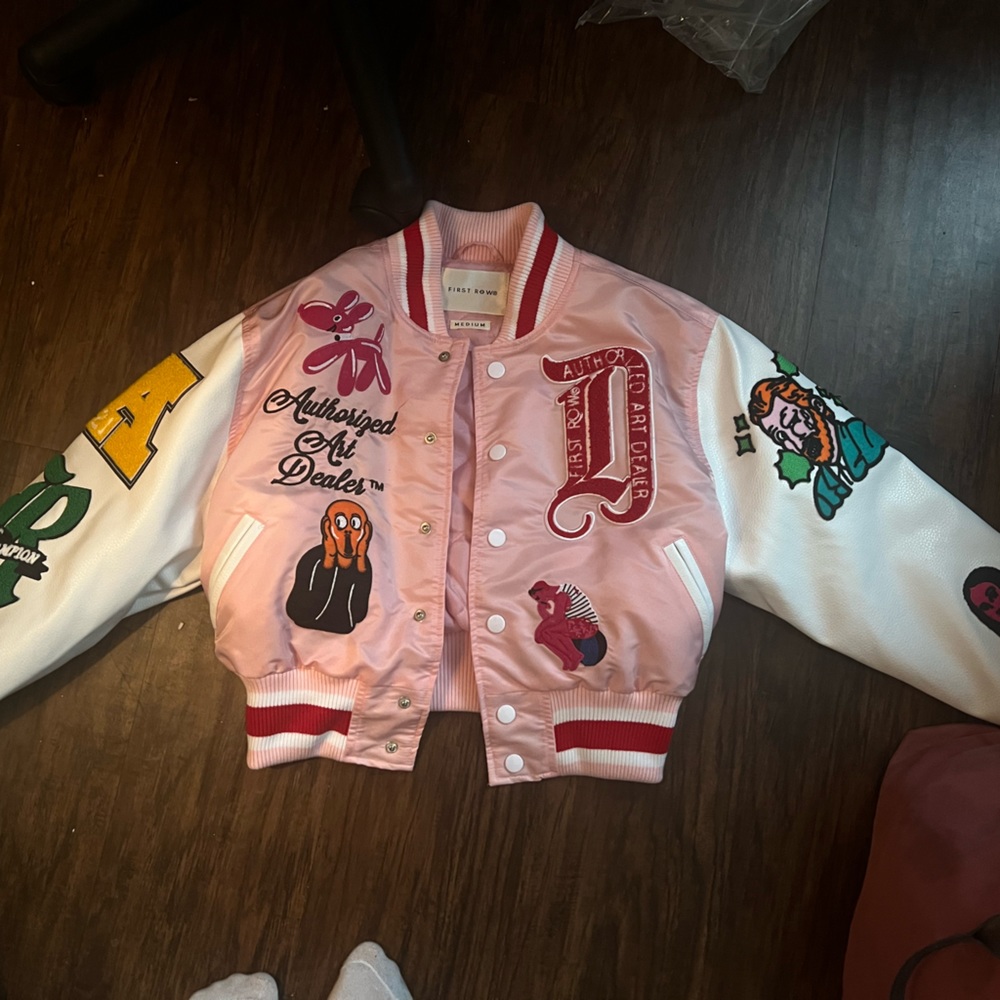 First Row Pink varsity leather jacket , with patches.